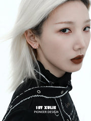 1ST XULIE "Silver Angel" Angel Hook Zircon Stud Earrings in Platinum Plated 925 Sterling Silver - Product View on textured background