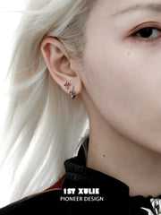 1ST XULIE "Snake Bite" Asymmetrical Cross Stud & Huggie Earrings in Platinum Plated 925 Sterling Silver - On Model