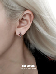 1ST XULIE "Snake Bite" Asymmetrical Cross Stud & Huggie Earrings in Platinum Plated 925 Sterling Silver - On Model Close-Up