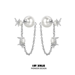 1ST XULIE "Whiterfly" Sculptural Butterfly Wing Pearl Stud Earrings in Platinum Plated Silver - Lifestyle Shot