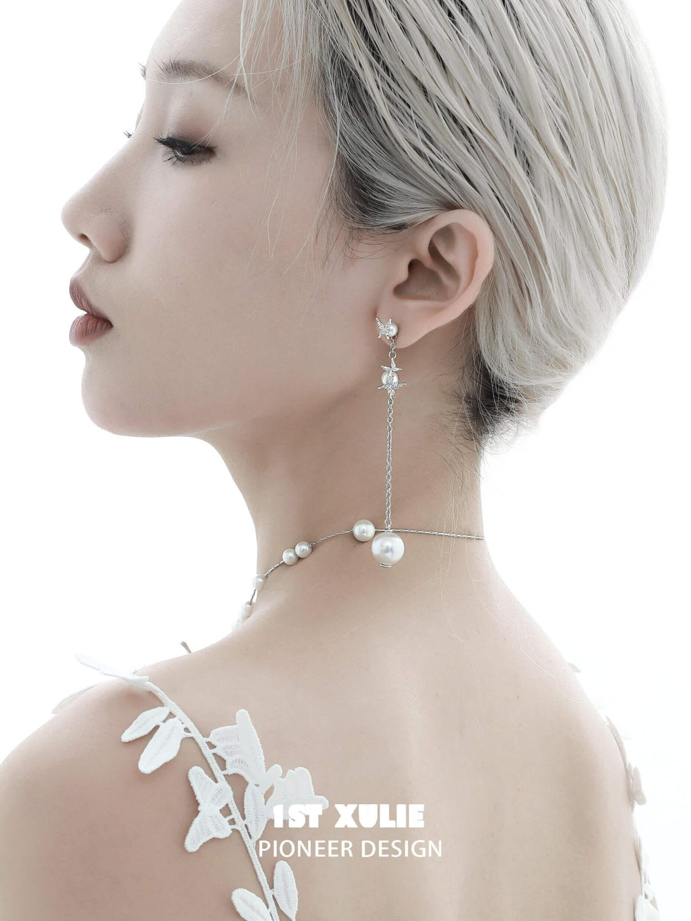 1ST XULIE "Whiterfly" Sculptural Butterfly Wing Pearl Stud Earrings in Platinum Plated Silver - On Model