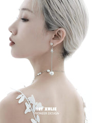 1ST XULIE "Whiterfly" Sculptural Butterfly Wing Pearl Stud Earrings in Platinum Plated Silver - On Model