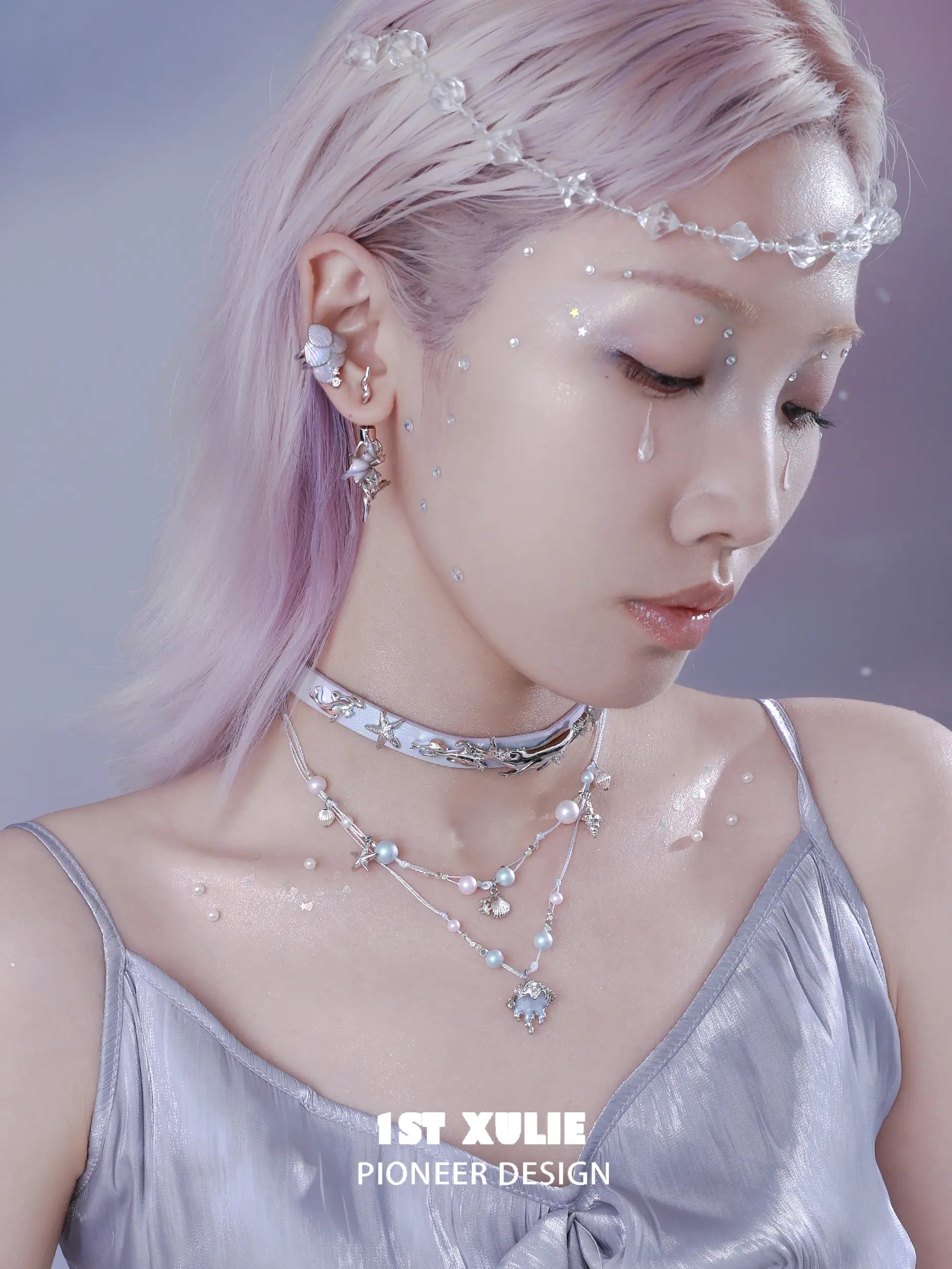 1ST XULIE "ATLANTIS" Mythical Conch & Fish Fin Statement Dangle Earrings in Platinum Plated Brass - On Model Close-up 1ST XULIE "ATLANTIS" Mythical Conch & Fish Fin Statement Dangle Earrings in Platinum Plated Brass - On Model Close-up