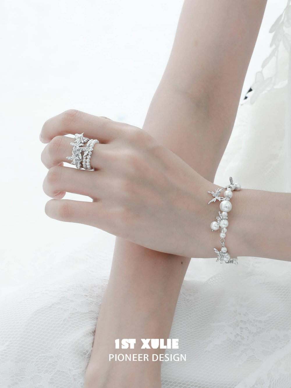 1ST XULIE "Whiterfly" Dainty Butterfly Pearl Charm Bracelet in Platinum Plated Brass - On Model Close-up