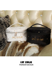 Black and light gray velvet makeup bags with gold 1ST XULIE branding.