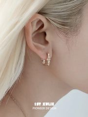1ST XULIE Jewelry "Bastet" Iris Dangle Huggie Hoop Earrings in Platinum Plated - Detail Shot
