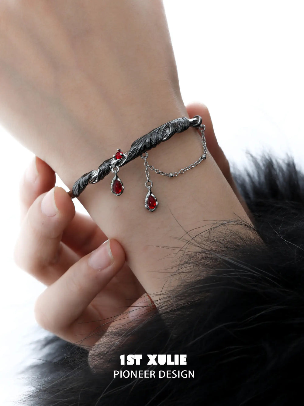 1ST XULIE "Lucifer" Collection featuring the Gothic Red Crystal Feather Ring and matching bracelet - Lifestyle Shot