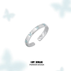 1ST XULIE "Whiterfly" Minimalist Stacking Logo Band Ring in 925 Sterling Silver - Product View on Display