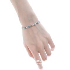 1ST XULIE "THE SEA" Ocean Blue Adjustable Link Bracelet in Platinum - On Model Close-Up