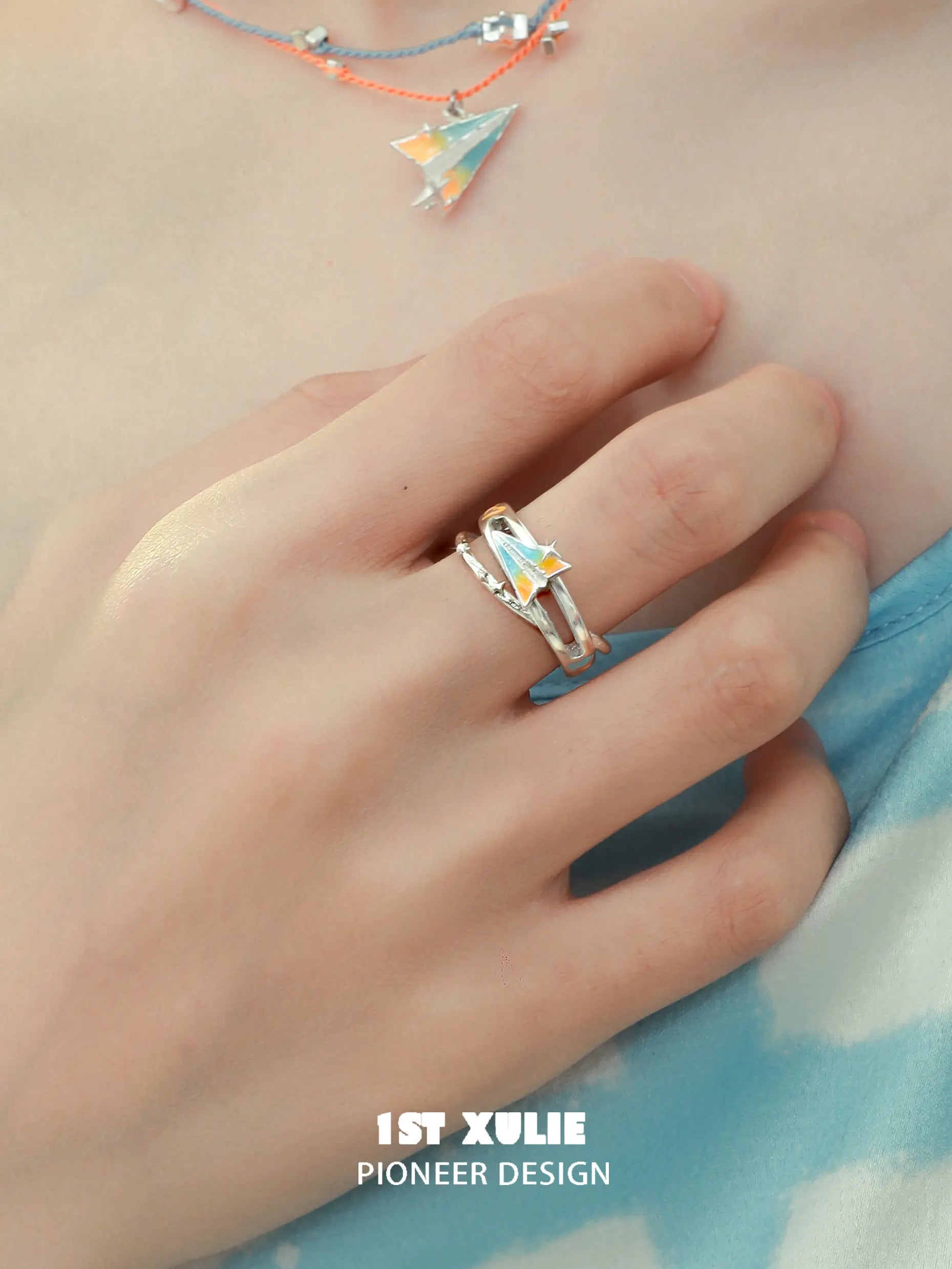 1ST XULIE Jewelry "Juicy Flight" Orange Sea Paper Plane Statement Open Ring in 925 Sterling Silver - On Model 1ST XULIE Jewelry "Juicy Flight" Orange Sea Paper Plane Statement Open Ring in 925 Sterling Silver - On Model