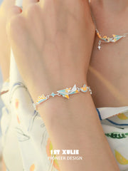1ST XULIE Jewelry "Juicy Flight" Dainty Paper Airplane Enamel Charm Bracelet in Platinum Plated - Detail Shot