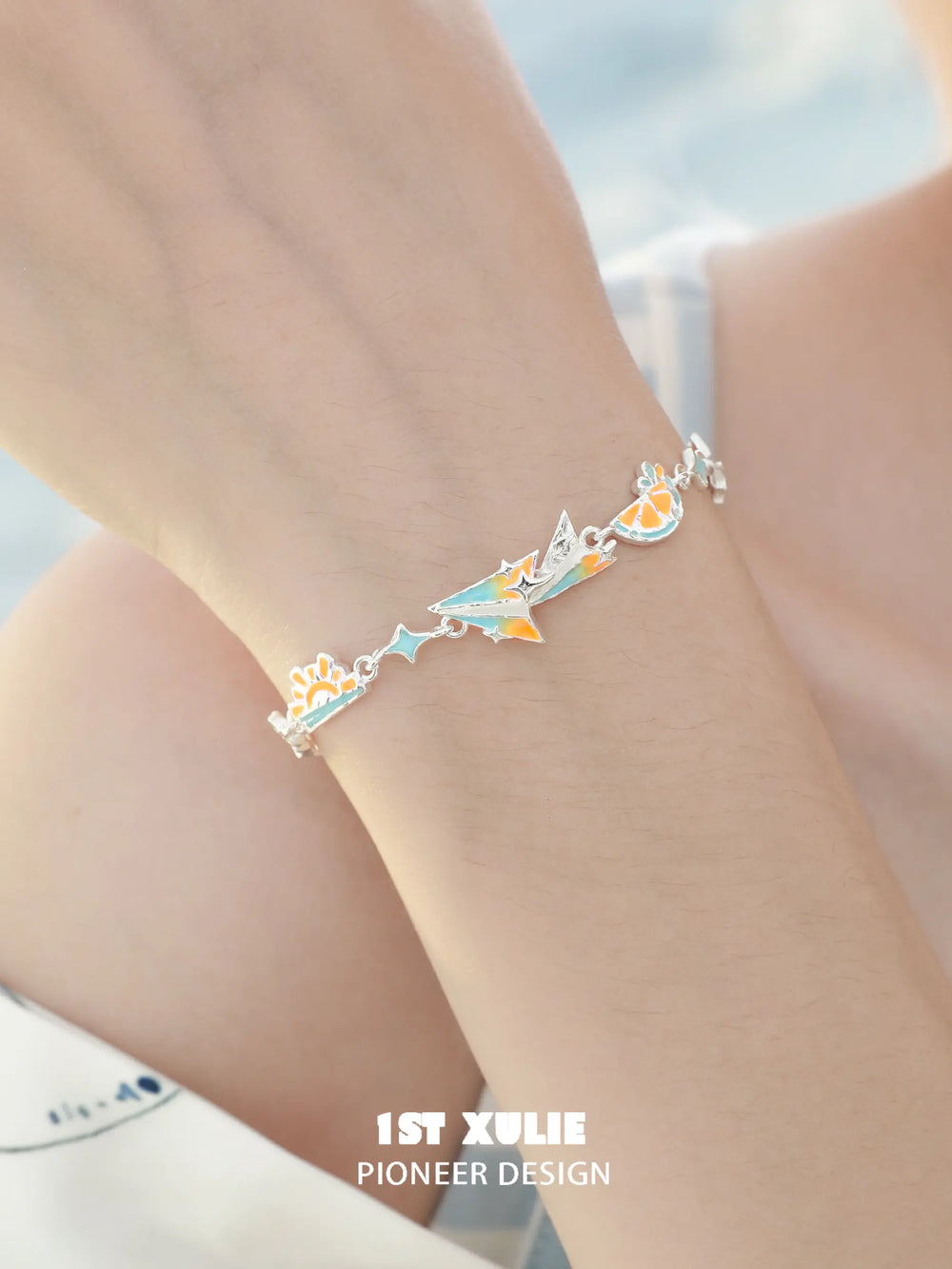 1ST XULIE Jewelry "Juicy Flight" Dainty Paper Airplane Enamel Charm Bracelet in Platinum Plated - Lifestyle Shot