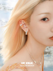 1ST XULIE Jewelry "Juicy Flight" Paper Airplane Charm Huggie Hoops in Platinum Plating - On Model Close-up