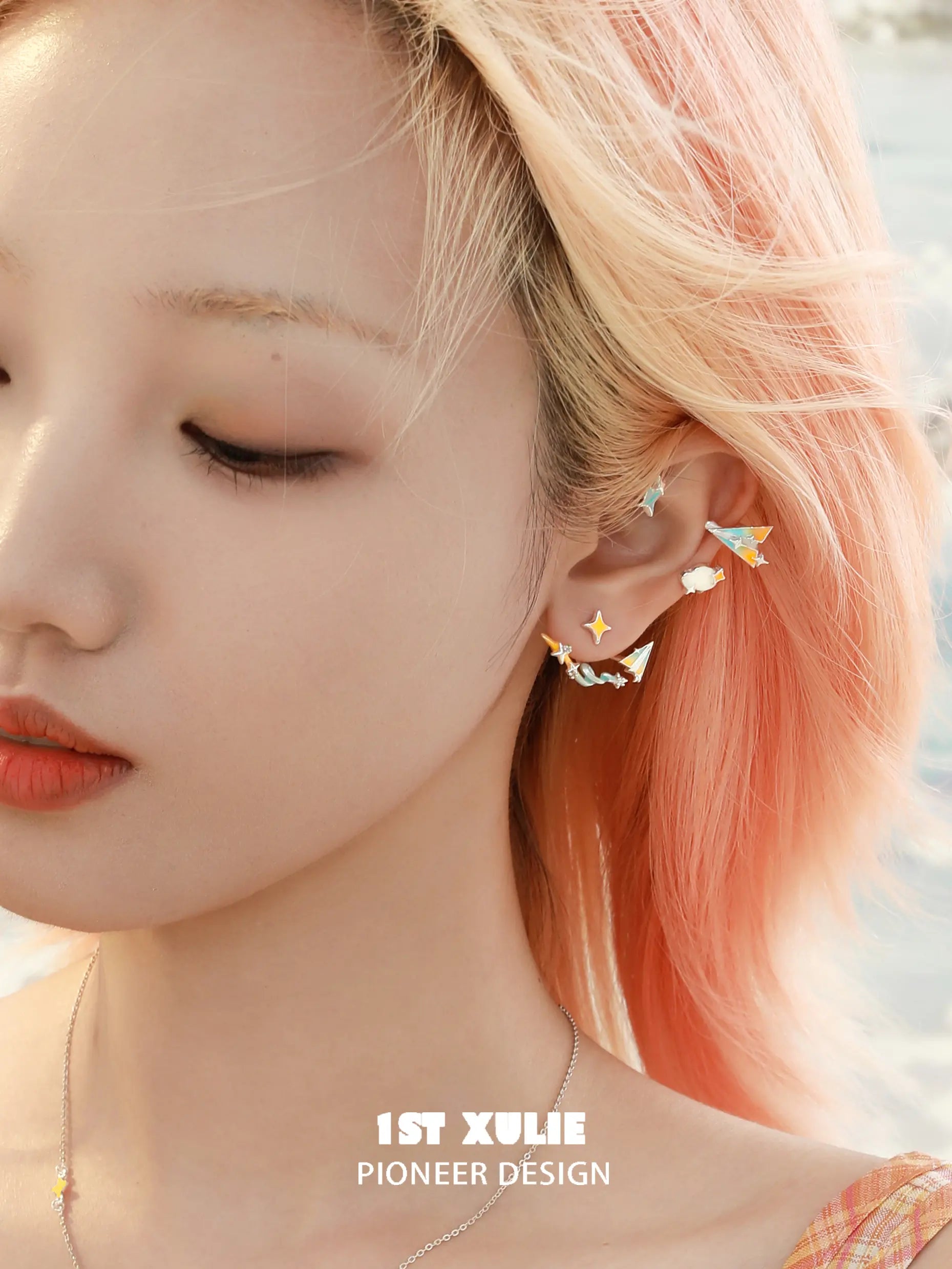 1ST XULIE "Juicy Flight" Asymmetrical Paper Airplane & Star Statement Stud Earrings with Enamel Accents - On Model 1ST XULIE "Juicy Flight" Asymmetrical Paper Airplane & Star Statement Stud Earrings with Enamel Accents - On Model