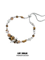 1ST XULIE Jewelry "LEOPARD CAT" Playful Leopard Cat Charm Bracelet in Platinum Plated Brass - Angle View