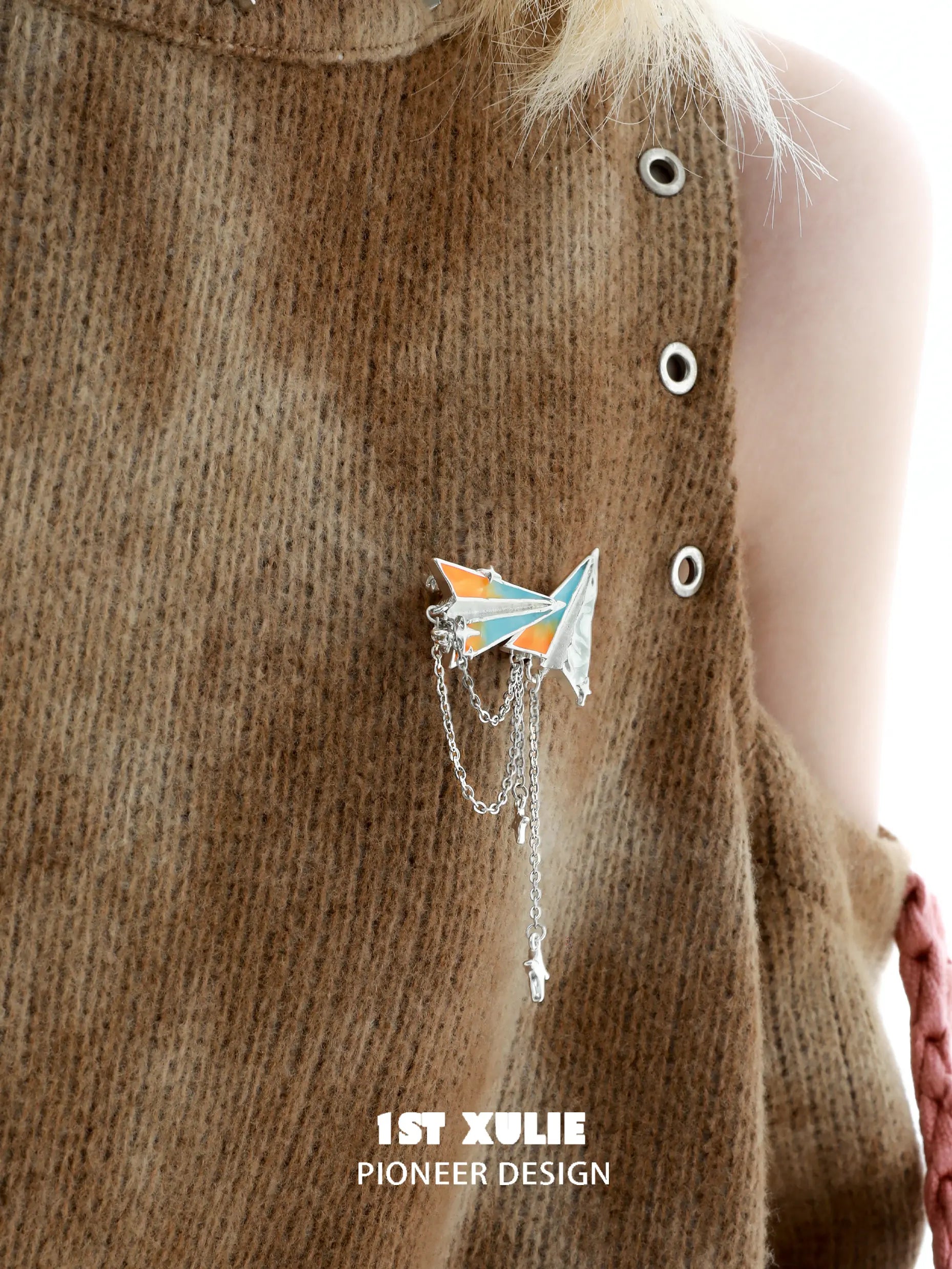 1ST XULIE "Juicy Flight" Playful Paper Plane Chain Brooch in Platinum Plated Brass - On Model Close-up 1ST XULIE "Juicy Flight" Playful Paper Plane Chain Brooch in Platinum Plated Brass - On Model Close-up