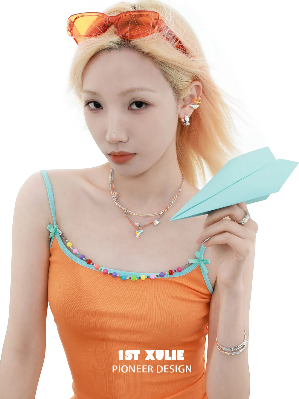 1ST XULIE "Juicy Flight" Playful Paper Plane Rope Choker in Platinum Plated Brass - Lifestyle Shot