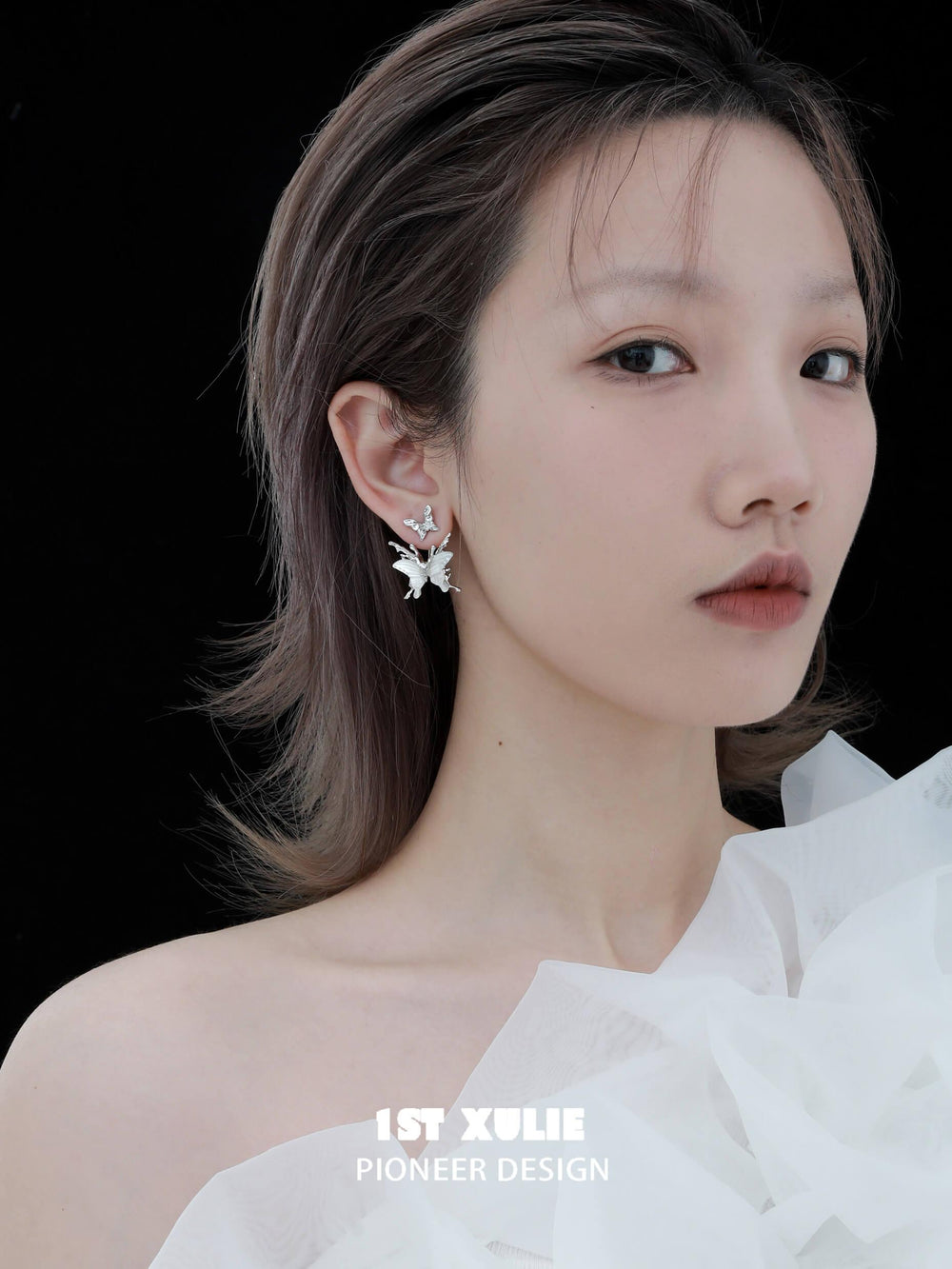 1ST XULIE "Whiterfly" Skeletal Shell Earrings in Platinum Plated 925 Silver - On Model