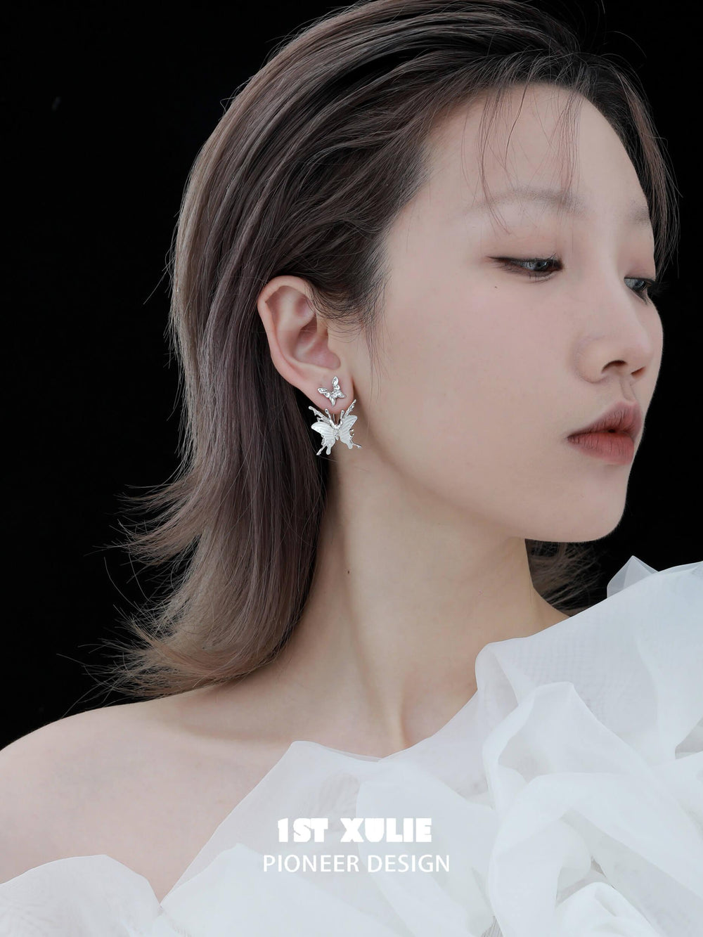 1ST XULIE "Whiterfly" Skeletal Shell Earrings in Platinum Plated 925 Silver - On Model Angled View