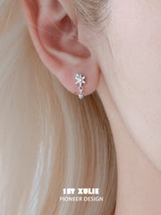1ST XULIE Jewelry "Snow Land" Sparkling Snowflake Huggie & Stud Earrings in Platinum Plated - Texture Shot