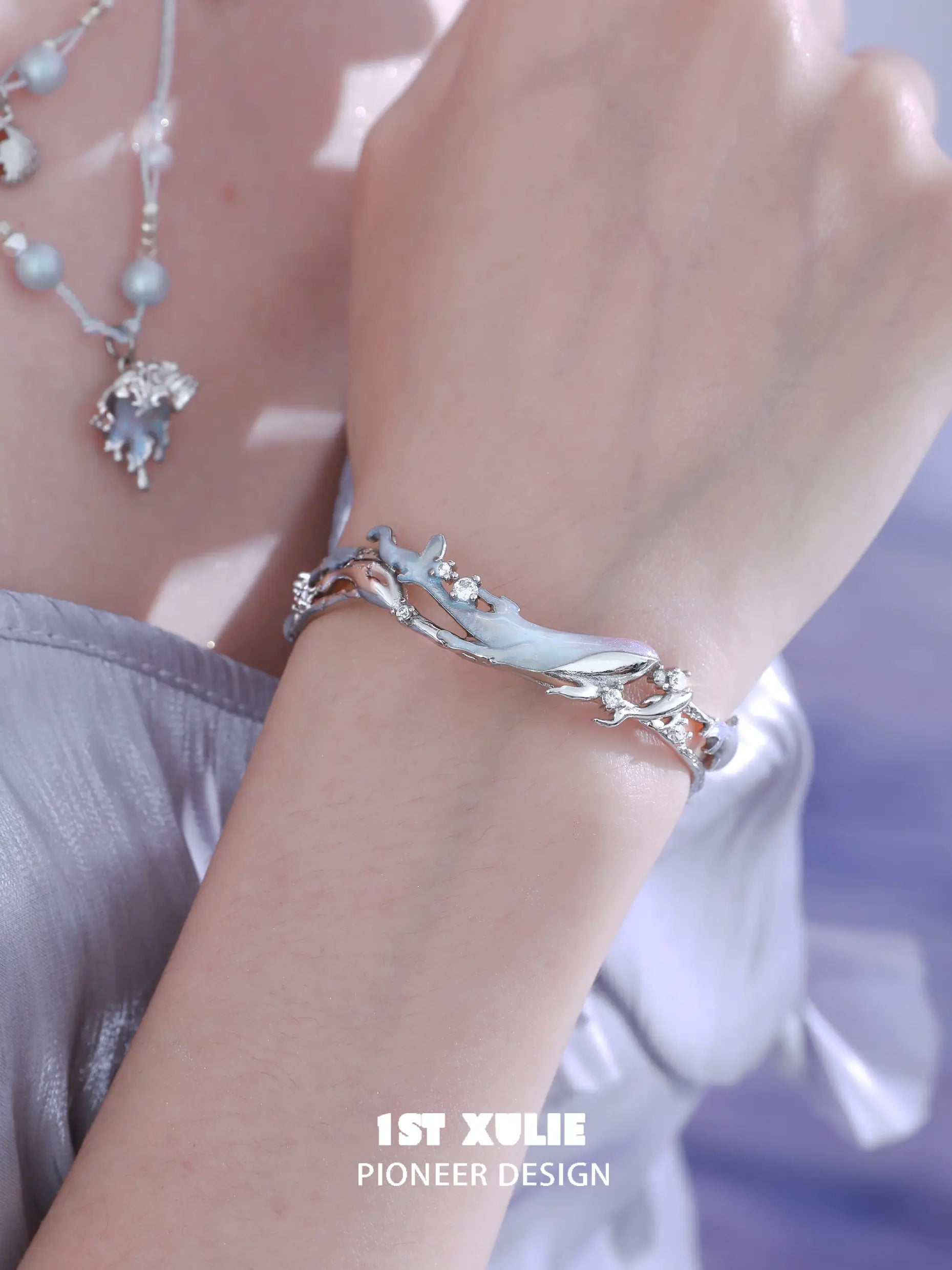 1ST XULIE "ATLANTIS" Statement Whale & Pearl Cuff Bangle in Platinum Plated - On Model 1ST XULIE "ATLANTIS" Statement Whale & Pearl Cuff Bangle in Platinum Plated - On Model