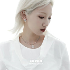 Angled view of the matching "Tears of Mermaid" Necklace for the 1ST XULIE White Agate and Pearl Halo Stud Earrings