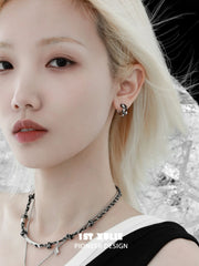 1ST XULIE "Snake Bite" Two-Tone Zirconia Statement Huggie Hoop Earrings in Platinum & 18K Black Gold Plating - Angled View