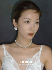 1ST XULIE "Whiterfly" White Shell Butterfly Necklace in Platinum & Titanium - Angled View
