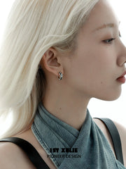 1ST XULIE "Mini World" Travel-Inspired World Map Huggie Hoop Earrings in Platinum Plated - On Model Close-Up