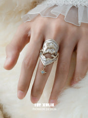 Celestial armor ring worn across the finger