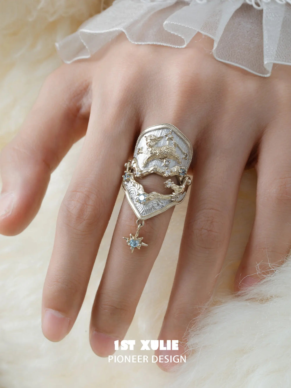 Celestial armor ring with a hanging star worn with coordinating jewelry