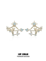 Gold-toned star earrings with detachable constellation-like lower sections