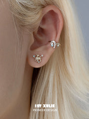Miniature ram stud worn on the lobe beside coordinating ear cuffs