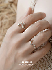 Ram and constellation open rings worn with coordinating jewelry