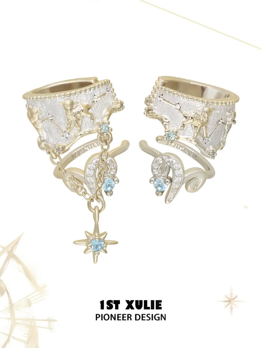 Gold-toned celestial ear cuff set with ram motifs, chains and a pale blue star