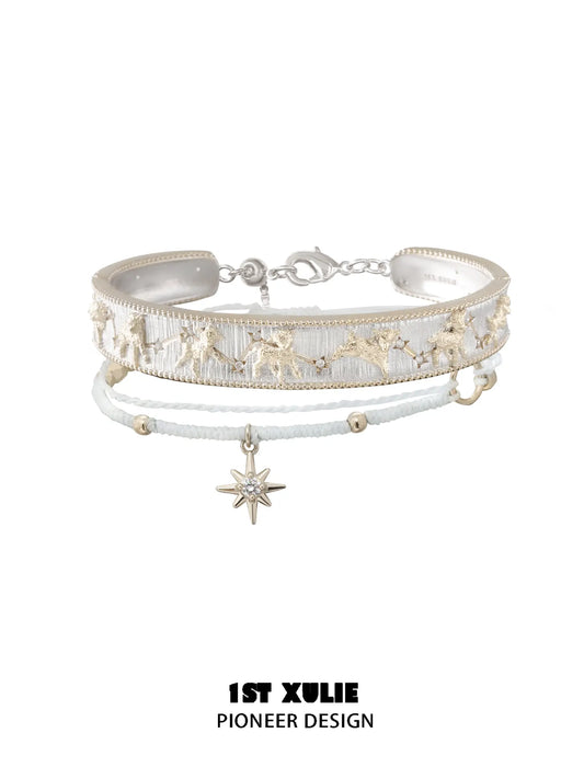 Celestial patterned bangle with a white cord star bracelet