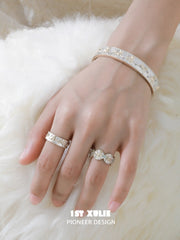 Celestial patterned open band ring worn with coordinating jewelry