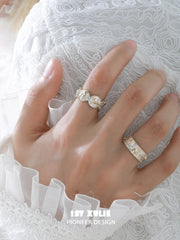 Celestial patterned open band ring worn with coordinating jewelry