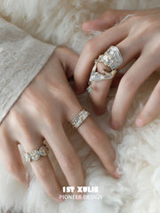 Patterned band styled with an elongated celestial ring
