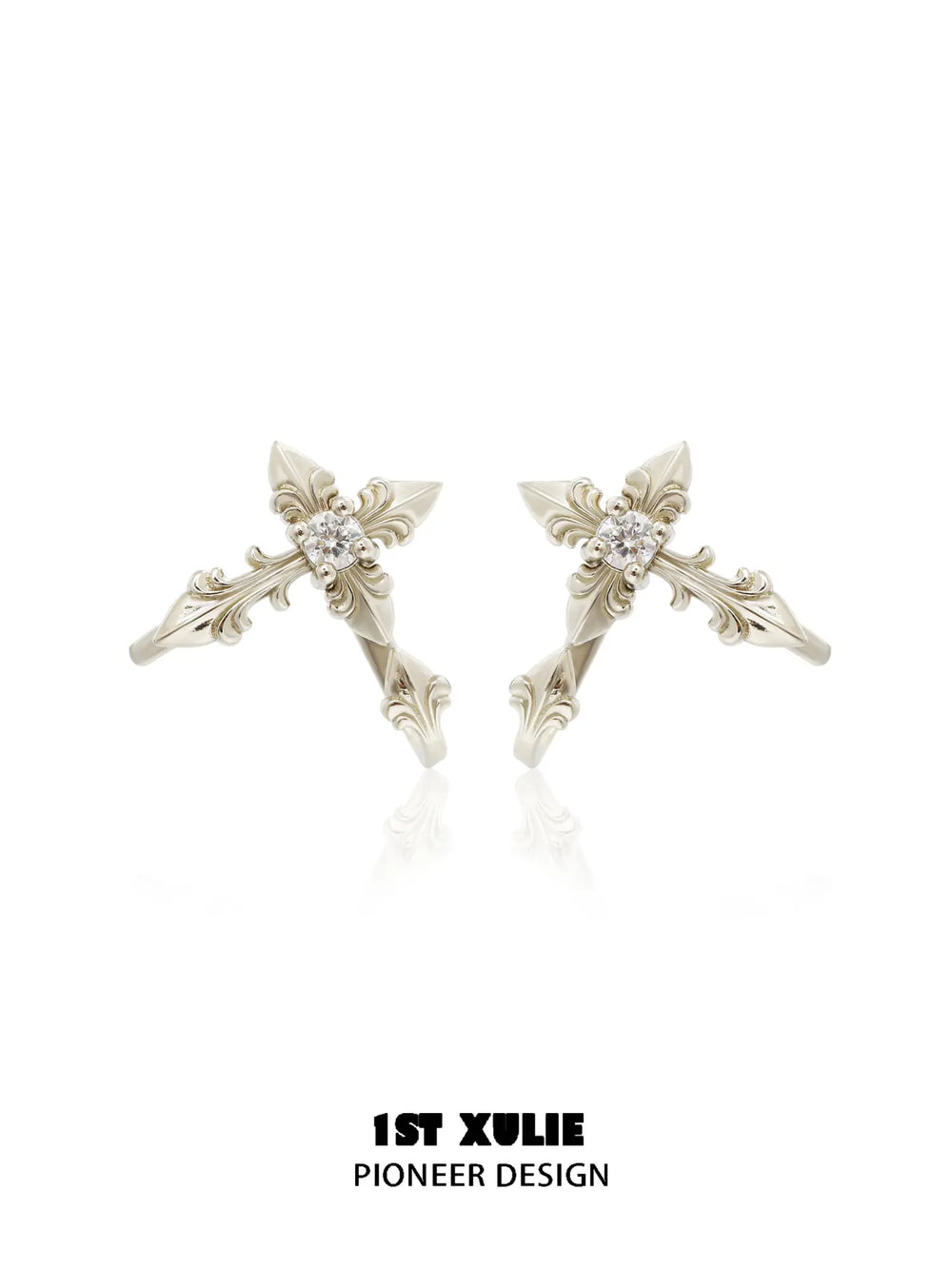 Gold-toned detachable fleur-de-lis earrings with elongated decorative sections