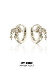 Gold-toned fleur-de-lis hoop earrings with clear stones and small hanging drops