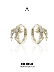 Style A gold-toned fleur-de-lis hoop earrings with small hanging details