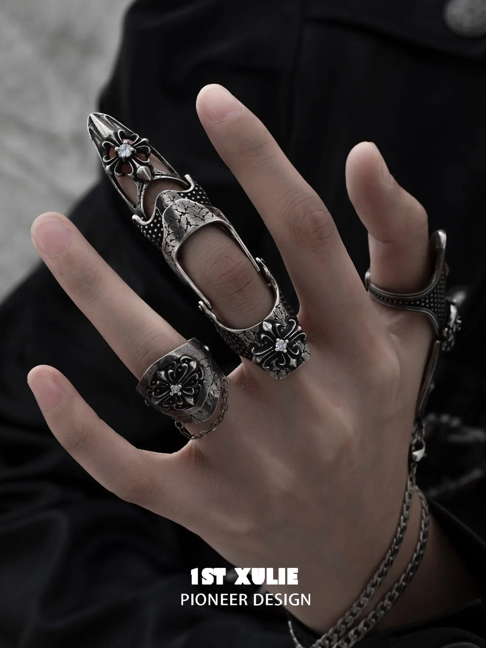 Gothic chain signet and long armor rings worn with coordinating jewelry