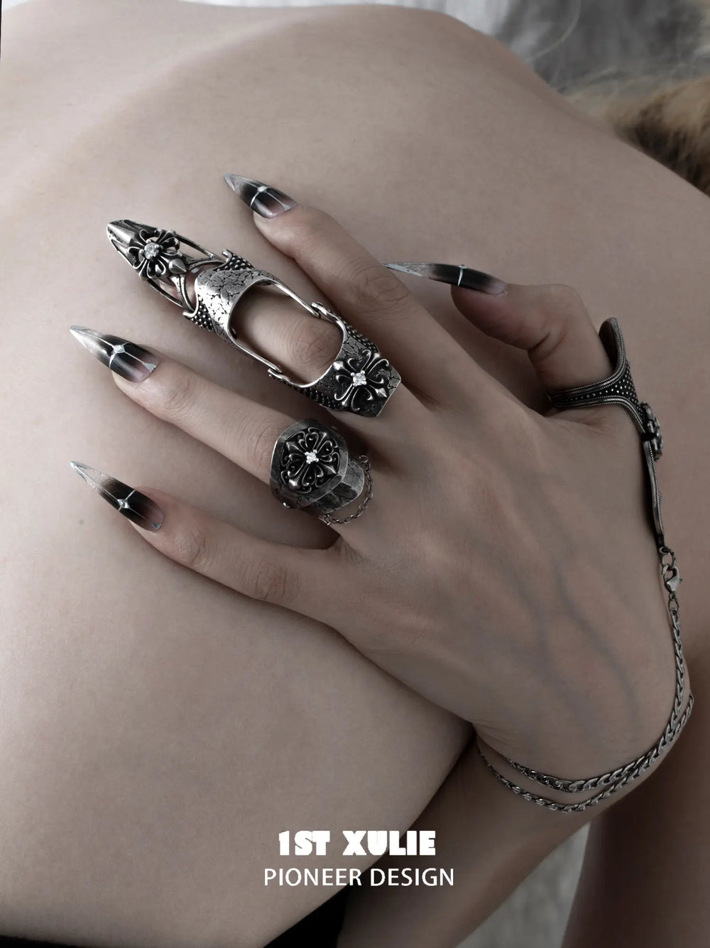 Short shield ring and long armor ring styled together on the hand