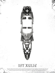 Long gothic armor ring on a pale ornamental background