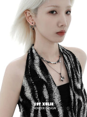 1ST XULIE "Snake Bite" Statement Black and White Serpent Stud Earrings in Platinum Plated - On Model Angle 2
