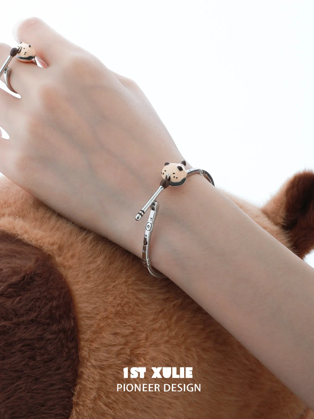 1ST XULIE Jewelry "POUR-OVER CAPYBARA" Enamel Capybara Zen Open Bangle in Enamel - Lifestyle Shot