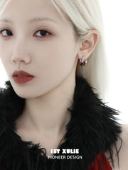 1ST XULIE "Soaring Cranes" Asymmetrical Crane Statement Feather Spiral Earrings in Platinum Plated Brass - Detail Shot