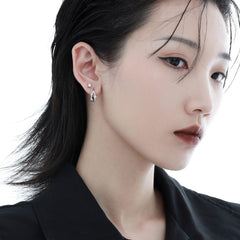 1ST XULIE "Star Trails" Dainty Four-Pointed Star Stud Earrings in 925 Sterling Silver - Angled View