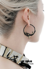 1ST XULIE "Swallow's Return" Gold Leaf Swallow Statement Hoop Earrings in 18K Black Gold Plate - Lifestyle Shot
